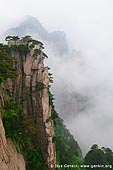 landscapes stock photography | Looking Down from Beginning to Believe Lookout, Beihai (North Sea) Scenic Area, Huangshan (Yellow Mountains), China, Image ID CHINA-HUANGSHAN-0018. Stock photo of the high cliff near the Beginning-to-believe lookout in Beihai Scenic Area (North Sea).