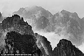 landscapes stock photography | Huangshan Mountains, Cloud-dispelling Pavilion, Xihai (West Sea) Grand Canyon, Baiyun Scenic Area, Huangshan (Yellow Mountains), China, Image ID CHINA-HUANGSHAN-0034. Huang Shan (Yellow Mountain), located in eastern China's Anhui Province, is famous for its countless jagged rock towers, beautifully wind-sculpted pine trees, and seas of swirling clouds. It resembles a sumi painting more than a real place. It is a subject of traditional Chinese paintings, literature and modern photography. It is UNESCO World Heritage Site, and one of China's major tourist destinations.
