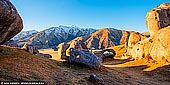 landscapes stock photography | Castle Hill Panorama in the Morning, Canterbury Region, South Island, New Zealand, Image ID NZ-CASTLE-HILL-0003. These limestone rock formations in Castle Hill in Canterbury Region, South Island, New Zealand are what's left after water eroded away the limestone formed during the Oligocene period 30-40 million years ago when much of present day New Zealand was covered by the sea. Natural erosion has weathered the higher parts into fantastic shapes, which are much loved by rock-climbers, and the whole area is a maze of towers, arches, holes and slabs that are a joy to explore.