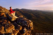 landscapes stock photography | Watching Beautiful Sunset from the Reed Lookout, The Grampians National Park (Gariwerd), Victoria, Australia, Image ID GRAMPIANS-0012. Stock photo of a person enjoying the view from the Reed Lookout at sunset in the Grampians National Park (Gariwerd) in Victoria, Australia.