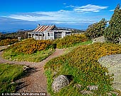 landscapes stock photography | Craig's Hut, Alpine National Park, Mansfield, Victoria, Australia, Image ID AU-MANSFIELD-CRAIGS-HUT-0003. Craig's Hut - one of the most famous High Country huts. Perched atop Mt Stirling, Craig's Hut offers stunning views of the ranges and is one of the regions most photographed landmarks. First built as a set for The Man From Snowy River film in 1981–82, the hut has now become an iconic symbol of Australia's settler history. In 2006 the Craig's Hut was burnt down by bushfires. It was completely rebuilt and reopened to the public in January 2008. It is situated on Mt Stirling, approximately 51 kilometres from Mansfield. The last 1.2 kilometres is only accessible by 4WD or via the walking track from the Day Visitor Area. Access tracks via Mt Stirling are closed to vehicles for Winter.