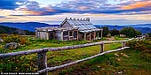 landscapes stock photography | Craig's Hut at Twilight, Alpine National Park, Mansfield, Victoria, Australia, Image ID AU-MANSFIELD-CRAIGS-HUT-0004. Craig's Hut near Mt Stirling, Victoria is considered as one of 100 Best Views In Australia. Drive up towards Mt Buller from Mansfield, then take a left after the Mirimbah tollgate onto Stirling Road. Then it's 8km of sealed road to Telephone Box Junction, the limit for vehicles in winter. But in the warmer months you can continue to the gravel by 2WD Circuit Road: turn left and drive for 20km to the junction with Clear Hills Track. From there it's a 20-minute walk or short 4WD drive to Craig's Hut. The spectacular, minimally developed Mt Stirling attracts cross-country skiers, horse riders and bushwalkers. The original Craig's Hut, inspired by those used by cattle drovers for temporary shelter, was built for the movie The Man from Snowy River (1982) but burnt down in a bushfire. This replica - with a tin rather than bark roof - was completed in 2008.