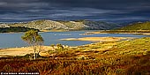 landscapes stock photography | Storm Approaching Falls Creek, Victoria, Australia, Image ID AU-VIC-FALLS-CREEK-0001. Dramatic photo of a storm approaching Rocky Valley Reservoir near Falls Creek in Victorian High Country in Australia. At sunrise the sunbeams broke through the threatening storm clouds and created magnificent and dramatic picture.