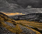 landscapes stock photography | Alpine National Park Hills After Sunset, Falls Creek, Victoria, Australia, Image ID AU-VIC-FALLS-CREEK-0002. The sky over the country landscape of Victorian High Country in Australia near Falls Creek begins to turn grey as the clouds take on a darkness bringing in the threat of a storm. The weather here can change in an instant and it would pay to take cover when threatening storm clouds like this are bearing down on you as most of the best spots to visit in the High Plains are in the open.