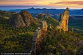 landscapes stock photography | The Breadknife and Warrumbungles at Dawn, Warrumbungle National Park, New South Wales (NSW), Australia, Image ID AU-WARRUMBUNGLES-0001. The Grand High Tops and Breadknife walk in Warrumbungle National Park, regarded as one of the best walks in NSW, offers close up views of the park's iconic rock formations. The Breadknife is a volcanic dyke in New South Wales, Australia. It is nearly 90 metres high, but often is only 4 m wide, which is particularly rare. The Breadknife was part of a large shield volcano, that first erupted about 17 million years ago and stopped about 13 million years ago.