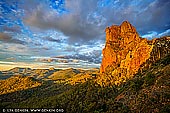 landscapes stock photography | Belougery Spire at Sunset, Warrumbungle National Park, New South Wales (NSW), Australia, Image ID AU-WARRUMBUNGLES-0002. This iconic Warrumbungle National Park walk is famous for its wildlife and vistas of rugged volcanic landscape. Breadknife and Grand High Tops walk is the jewel in the glistening crown and is must do for bush walkers who love a challenge with their scenery. The track follows Spirey Creek before climbing steeply to give close encounters with iconic formations such as Belougery Spire, Bress Peak and Crater Bluff.