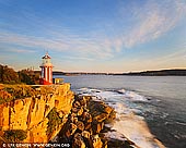landscapes stock photography | Hornby Lighthouse at Sunrise, South Head, Watson Bay, Sydney, New South Wales (NSW), Australia, Image ID AU-HORNBY-LIGHTHOUSE-0003. Hornby Lighthouse stands tall at South Head, near Watsons Bay in Sydney Harbour National Park. The iconic red and white striped tower is surrounded by magnificent views: Sydney Harbour to the west, Middle Head and North Head to the north, and the expansive Pacific Ocean to the east. The lighthouse was built in 1858 following the wrecking of the Dunbar at the foot of South Head. Designed by colonial architect Alexander Dawson, Hornby Lighthouse was the third lighthouse to be built in NSW. Hornby Lighthouse is accessible via the South Head heritage trail – an easy walk that leaves from Camp Cove at Watsons Bay, taking you past historic gun emplacements before reaching Hornby Lighthouse.