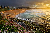 landscapes stock photography | Stormy Sunrise at Bondi Beach, Sydney, NSW, Australia, Image ID AU-BONDI-BEACH-0003. Threatening storm clouds loom above Bondi Beach in Sydney, NSW, Australia during a very vivid sunrise. While most people take cover at the first sign of a storm or the gathering of menacing clouds, a scene like this is almost too good to leave without a photo.