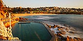 landscapes stock photography | Bronte Swimming Pool at Sunrise, Bronte Beach, Sydney, NSW, Australia, Image ID AU-BRONTE-BEACH-0001. Featured on postcards and artworks since the early 1900s, this attractive saltwater pool in Bronte, Sydney, NSW, Australia attracts a myriad of people all year round. This is a great space for serious swimmers looking to brush up on their laps. With five lanes, an irregular shape and plenty of space it's no wonder Bronte Baths brings in the crowds. Since the 19th century this has been home to competition swimmers. Perched on the edge of the fabulous Bronte Beach its completely free and suitable for all age groups who want to get wet in a safe area.