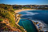 landscapes stock photography | Bronte Beach at Sunrise, Bronte, Sydney, NSW, Australia, Image ID AU-BRONTE-BEACH-0002. Bronte Beach is one of Sydney's best-kept outdoor spaces and its best-kept secrets. It is a true local hangout, year round. Bronte baths lie at the southern end of the beach, with a 30 metre lap pool suitable for the serious swimmer as well as a shallow enclosure perfect for kids. The surrounding Bronte Park is spacious enough to host the ever popular family barbies, excitable dogs as well as that essential game of cricket. The park is also lined by Bronte Road's string of charming cafes to its south.