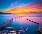 landscapes stock photography | Beautiful Sunrise at Bronte Baths, Bronte Beach, Sydney, NSW, Australia, Image ID AU-BRONTE-BEACH-0007. Bronte Beach is one of the best places in Sydney to watch a sunrise. While it's cold here in winter, Sydney tends to get the most intense colour sunrises and sunsets in late autumn, winter and early spring so it's often worth braving the cold and go shooting. Take a cup of hot coffee with you - you will need it for a winter sunrise.