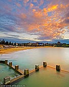 landscapes stock photography | Beautiful Sunrise Above Coogee Beach, Sydney, NSW, Australia, Image ID AU-COOGEE-BEACH-0003. Coogee Beach is one of the best places to see sunrise in Sydney, NSW, Australia. With a shimmering beach, magnificent coastal walk and a protected Marine Reserve that attracts snorkellers and scuba divers, Coogee sums up the classic Sydney surf scene. It's a haven for families, couples and travellers alike. A diverse abundance of nearby cafes and restaurants will suit anyone's dining needs.