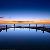 landscapes stock photography | Ivo Rowe Pool at Sunrise, Coogee, Sydney, NSW, Australia, Image ID AU-IVO-ROWE-POOL-0002. Blue Sunrise at Ivo Rowe Pool in Coogee, NSW, Australia. It is one of four rock/tidal pools in Coogee area. The other pools are Coogee Baths, the Ladies Pool and Wylies Baths. It is tiny tidal pool located on the rock platform at South Coogee. The Ivo Rowe Pool is a little gem for photographers as allows to create minimalist photography with incredible rocks that surround this little hole in the rocks.