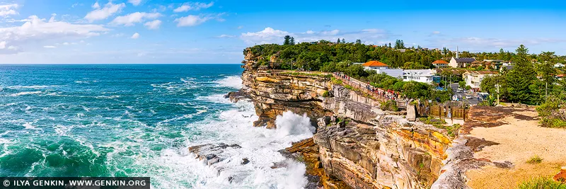 landscapes stock photography | Sea's Resolve, The Gap in Sydney, Watsons Bay, NSW, Australia. There is a rare sense of release in this coastal expanse, where the ocean moves with force and clarity against the carved sandstone edge. Living alongside this scene brings a feeling of open breath and inner steadiness, balancing wild energy with calm horizon lines. The late-morning light lifts the blues and mineral tones into something quietly restorative, while the restless water lends the space a feeling of motion, freedom, and timeless rhythm. As a design anchor, this piece holds a room with confidence, drawing the eye through its sweeping panorama and the dramatic meeting of sea and cliff. The rich ocean blues, chalky whites, and sunlit ochre tones respond beautifully to natural light, giving the wall a luminous, layered presence throughout the day. In refined residential interiors or executive settings, it becomes especially powerful in a commanding large-format museum presentation, where its scale expands the perceived boundaries of the room and allows the scene's full presence to unfold.