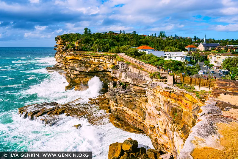 landscapes stock photography | Edge of Resolve, The Gap in Sydney, Watsons Bay, NSW, Australia. There is a grounded intensity in this coastal scene, where waves rise and break against sculpted stone with unwavering rhythm. Living alongside it brings a feeling of clarity and release, as if the room itself opens outward to salt air, distance, and elemental calm. The late-morning light softens the power of the sea with a luminous freshness, balancing movement and stillness in a way that feels both energising and deeply centring. As a design anchor, this piece brings structure and atmosphere to refined interiors, holding the wall with a quiet authority. Its mineral ochres, sea blues, and crisp whites respond beautifully to changing daylight, adding depth and radiance across the surface. In a sophisticated residential setting or executive space, it becomes most compelling in a commanding large-format museum presentation, where its presence expands the perceived scale of the room and allows the cliff line and ocean energy to fully resonate.