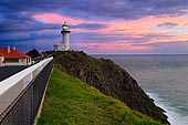 landscapes stock photography | Storm Clouds above Cape Byron Lighthouse at Sunrise, Byron Bay, New South Wales (NSW), Australia, Image ID AU-BYRON-BAY-LIGHTHOUSE-0001. The Cape Byron Lighthouse is located on the Cape Byron, Australia's the most easterly point of the mainland, near Byron Bay town. Cape Byron lighthouse was built in 1901 and for a century alerted passing ships to the dangers of the coast. In 1956 the light became Australia's most powerful lighthouse. Byron Bay Lighthouse has become an icon for Byron Bay and is a must for any visitor to Byron Bay. Take an early-morning walk to see the sun come up over the Pacific, and watch the pink glow on the lighthouse turn to stark white in the morning sun.