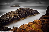 landscapes stock photography | The Fingal Head, Tweed Heads, New South Wales (NSW), Australia, Image ID AU-FINGAL-HEAD-0001. The feature of Fingal Head is the incredible Basalt rock formations. These cooling columns are quite amazing, they are hexagonal rocks of black basalt stacked together like some kind of crazy puzzle. This headland is an outcrop of Tertiary basalt aged 22 - 24 m.y. - part of the widespread volcanic activity in northeastern NSW and southeastern Qld which produced many well known volcanic features. The lava formed vertically-jointed columns through contraction due to cooling while stationary (rather than flowing). The joints (cracks) are exposed today as the outlines of mostly 6-sided columns, but some appear to have 3, 4, 5 and 7 sides.