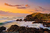 landscapes stock photography | Tacking Point Lighthouse at Sunrise, Port Macquarie, Mid North Coast, NSW, Australia, Image ID AU-PORT-MACQUARIE-0001. Tacking Point Lighthouse is Australia's third oldest lighthouse. It was built on a rocky headland about 8 kilometres south of Port Macquarie in 1879 by Shepherd and Mortley, to a design by the New South Wales Colonial Architect, James Barnet. The lighthouse was one of a series of five small navigational lighthouses of this design. The Keeper was withdrawn in 1919 when the light was replaced by automatic flashing lights. The foundations of the Lighthouse Keeper's Cottage can be seen next to the lighthouse. This building has been classified by the National Trust.