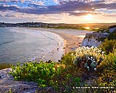 landscapes stock photography | Sunset at North Curl Curl Beach, Sydney, NSW, Australia, Image ID AU-CURL-CURL-0006. Beautiful sunset at North Curl Curl Beach in Sydney, NSW, Australia. Visitors have stunning views of the Curl Curl Beach and the ocean. During a typical coast sunset, the scenery is ignited and the grasses glow in the golden light.