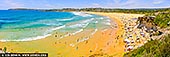 Golden Heat at North Curl Curl - Fine art print of Sydney, NSW, Australia - North Curl Curl blazes with summer energy in this vivid panoramic capture - a tapestry of golden sand, turquoise water, and sun-drenched joy. The beach curves gracefully beneath sandstone cliffs, where sunbathers find shade under umbrellas and children dart between tide pools and gentle surf. The vibrant blues of the ocean meet the warm ochres of the shoreline, creating a scene alive with movement, color, and freedom. This is coastal Australia at its most iconic - carefree, communal, and utterly radiant. A perfect artwork to infuse any space with the warmth and vitality of an endless summer. - Image ID: AU-CURL-CURL-0014
