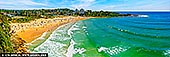 Emerald Break at Freshwater Beach - Fine art print of Sydney, NSW, Australia - The vibrant emerald waters of Freshwater Beach shimmer beneath the Australian summer sun, drawing surfers by the dozens to its rolling waves. From this elevated perspective, the golden arc of sand is alive with beachgoers, umbrellas, and laughter, set against a backdrop of leafy headlands and coastal homes. The swell glides in with rhythmic grace, catching the light and surfers alike, as the energy of the day hums across land and sea. A perfect harmony of movement, color, and life, this panoramic coastal artwork infuses any room with warmth and vitality - an uplifting centrepiece for beach houses, bright living spaces, or creative retreats. - Image ID: AU-FRESHWATER-BEACH-0006