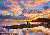 Ember Reverie, The Fairy Bower pool in Manly - Fine art print of Sydney, NSW, Australia - A radiant hush settles across the room through this dawn-lit seascape, where molten gold, soft apricot and tranquil blue dissolve into still water and open sky. Living alongside this scene brings a sense of spacious calm and quiet renewal, as though the first light of day has been invited indoors to soften the mind and steady the rhythm of a home. As a commanding visual focal point, this work anchors refined residential interiors, executive offices or coastal-inspired spaces with both warmth and poise. Its luminous tones shift beautifully with natural light on the wall, moving from gentle glow to rich evening depth, and in a large-format museum presentation, the scene truly comes alive - expanding the perceived boundaries of the room while lending it a cultivated, immersive presence. - Image ID: AU-MANLY-BEACH-0009