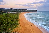 landscapes stock photography | Mona Vale Beach at Dawn, Mona Vale Beach, Sydney, NSW, Australia, Image ID AU-MONA-VALE-0002. From the lookout on the hills of Robert Dunn Natural Reserve in Sydney, Australia, visitors have stunning views of the Mona Vale Beach and the ocean. Soft pastel colours fill the sky and entire scene while water sweeps along the beach.