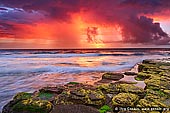 landscapes stock photography | Storm Clearing over Turimetta Beach, Turimetta Beach, Sydney, NSW, Australia, Image ID TURIMETTA-BEACH-0014. Turimetta Beach is located on the famous Northern Beaches in Sydney, NSW, Australia. It is a gorgeous place of exquisite coastal scenery, especially at sunrise like in this picture - the sky is all vivid and bright red, orange and yellow colors and the rocks are covered with green and yellow moss while storm is clearing over the ocean.