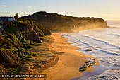 landscapes stock photography | Golden Sunrise at Turimetta Beach, Sydney, NSW, Australia, Image ID TURIMETTA-BEACH-0020. A golden sunrise glows on the Turimetta Beach in Sydney, NSW, Australia. Stock photo of the Turimetta Beach at sunrise with bright sky above in this photo of a sandy section of the beach.