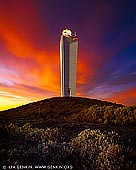 landscapes stock photography | Late Sunset at Cape Jervis Lighthouse, Fleurieu Peninsula, South Australia (SA), Australia, Image ID AU-CAPE-JERVIS-LIGHTHOUSE-0003. Cape Jervis Lighthouse with dramatic red, orange and yellow clouds above catching last rays of the setting sun. The lighthouse marks the northern entrance to the Backstairs Passage between the mainland and Kangaroo Island. Located on the cape at Lands End, the tip of the Fleurieu Peninsula, about 1.5 km (1 mi) south of the town of Cape Jervis and 400 m (1/4 mi) north of the Kangaroo Island ferry terminal. Cape Jervis is the jumping off point for daily car and passenger ferry services to Kangaroo Island. It's a 45 minute journey that reveals the spectacular coastline of this part of the Fleurieu Peninsula. Cape Jervis is a popular base for fishermen, with good boat, jetty and beach fishing. Cape Jervis is on Tourist Route 52 and part of the Fleurieu Way Tourist Drive.