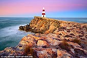 landscapes stock photography | Robe Obelisk at Sunrise, Limestone Coast, South Australia, Australia, Image ID AU-ROBE-0001. The Obelisk was erected on Cape Dombey near Robe, South Australia in 1852 and was used to navigate the entrance to Guichen Bay, as well as to store rocket lifesaving equipment. The firing of rockets, carrying baskets to distressed ships to bring passengers ashore, saved many lives. It later assisted passing ships with navigation because its height of 12m (40 ft) makes it visible 20km (12mles) out to sea. The erosion of the land surrounding the obelisk will mean it will eventually fall away so make sure you visit this icon whilst staying in Robe.