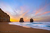 landscapes stock photography | Gog and Magog at Sunrise, The Twelve Apostles, Great Ocean Road, Port Campbell National Park, Victoria, Australia, Image ID APOST-0032. To really appreciate the Port Campbell National Park take 86 steps down to the beach to be dwarfed by the 70m high vertical cliffline and the enormous offshore stacks. Visitors can walk in both directions along the sand. The two offshore rock stacks that may be viewed from both the viewing platform and (tide and sea permitting) from beach level are known locally as Gog and Magog and are an amazing photo opportunity.