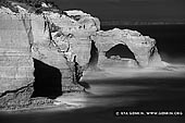 landscapes stock photography | The Arch in Black and White, The Twelve Apostles, Great Ocean Road, Port Campbell National Park, Victoria, Australia, Image ID APOST-0026. Beautiful black and white moody view of The Arch near the Twelve Apostles along the Great Ocean Road in Port Campbell National Park, Victoria, Australia.