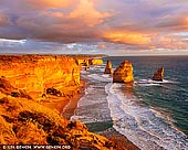landscapes stock photography | Vivid Sunset at The Twelve Apostles, Great Ocean Road, Port Campbell National Park, Victoria, Australia, Image ID APOST-0035. The viewing platform at the world-famous Twelve Apostles site offers exceptional views out across this ancient rock formation, where the jutting shapes carve interesting silhouettes against the setting sun. At just a five-minute walk from the car park, the viewing platform is the ideal place to catch sunrise or sunset. While the location is open all year round, the best time to shoot here is in the late spring through to the early autumn when the weather is warm. The Apostles are best viewed at sunrise and sunset. However, on a day with a lot of cloud activity, you can probably pull off some good shots through till the late morning.