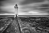 landscapes stock photography | Port Fairy Lighthouse, Port Fairy, Victoria (VIC), Australia, Image ID AU-PORT-FAIRY-LIGHTHOUSE-0001. The Port Fairy Lighthouse was built in 1859, on what was then Rabbit Island, as a navigation aid at a time when Port Fairy was becoming an important trading port for western Victoria. This later became part of Griffith Island. The light is 41 feet above high watermark and its visibility to seaward is 12 miles. The lighthouse was initially manned by two keepers. The last keeper to live on the island was there from 1929 to 1954, when the light was automated; the two stone keepers' cottages were subsequently demolished in about 1956. Griffiths Island is a beautiful destination for a day trip or weekend away, with several scenic walks and picnic spots with a captivating view of the sea.