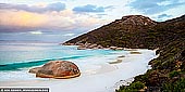 landscapes stock photography | Little Beach and Mt Gardner at Sunset, Two Peoples Bay Nature Reserve, Western Australia (WA), Australia, Image ID AU-WA-LITTLE-BEACH-BEACH-0001. Little Beach is a beautiful and secluded white sandy beach in the Two Peoples Bay Nature Reserve, 35 kilometres east of Albany. It is one of the most beautiful beaches on the south-west coast. Beautiful turquoise waters, white sand and large waves make Little Beach a must-see for travellers to the region. It is a beautiful walk along the beach to where a giant stone stands alone against the sea. The name 'Two Peoples Bay' is from an incident in 1803 when an American whaling ship used the sheltered waters to lay anchor at the same time as a French vessel that was exploring the coastline east of Albany.