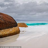 landscapes stock photography | Stormy Day at Little Beach, Two Peoples Bay Nature Reserve, Western Australia (WA), Australia, Image ID AU-WA-LITTLE-BEACH-BEACH-0004. 35km east of Albany the Two People's Bay Nature Reserve is home to the magnificent stretch of beach known as Two Peoples Bay and the spectacular Little Beach - a real favourite with the locals. The finest white sand and the bluest of blue sea meet to create an idyllic secluded spot you mustn't miss when visiting Albany. Take a stroll along the clean white sand of Little Beach and enjoy a scenic view over rolling hills and small granite outcrops. Two Peoples Bay Nature Reserve is about half an hour drive from Albany. Albany is a four and a half hour drive from Perth or you can fly there in just over an hour.