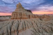 landscapes stock photography | The Walls of China (Lunette) at Sunset, Mungo National Park, NSW, Australia, Image ID AU-MUNGO-0012. Picture of the dramatic blue and yellow-orange storm clouds over the walls of China (Lunette) at sunset in Mungo National Park, NSW, Australia. Last rays of the low sun highlighted threatening clouds.