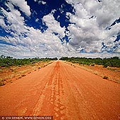 landscapes stock photography | Red Australian Rural Road With Clouds in Blue Sky, NSW Outback, Australia, Image ID AU-OUTBACK-0001. Red earth and blue sky - the Australian Outback. The Outback is one of those rare experiences that taps into the very essence of the Australian heritage. The NSW Outback provides a unique Australian experience that brings visitors in contact with the ancient and spectacular landscape of the Outback. Here you'll find rugged beauty, vivid red earth, bright blue skies, endless horizons and prolific native wildlife.