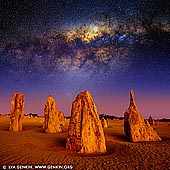 landscapes stock photography | Starry Night in The Pinnacles Desert, Nambung National Park, WA, Australia, Image ID AU-NAMBUNG-PINNACLES-0002. Western Australia has some of the darkest night skies in the world, thanks to its large mass and remoteness to the rest of Australia (and the rest of the world). Plus, being in Earth's southern hemisphere, it shows off one of the best views of the Milky Way Galaxy in the world. In addition, you also get vivid views of the stunning Magellanic Clouds, the Jewel Box cluster of stars and the Southern Cross, which cannot be seen in Europe or America. The Pinnacles are situated in Nambung National Park just 250km north of Perth City. Astro-photography enthusiasts frequent here often to capture interesting images of the Milky Way Galaxy arching above the limestone structures. Under moonlight, the shapes of the pinnacles cast awesome shadows that make for great photos.