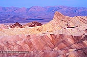 Sunrise at Zabriskie Point - Fine art print of Death Valley, California, USA - First dawn light at Manly Peak (Manly Beacon) at Zabriskie Point in Death Valley National Park, California, USA, showing convolutions, texture, and color contrasts in the eroded rocks. - Image ID: US-DEATH-VALLEY-0002