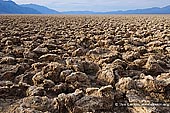 landscapes stock photography | Devil's Golf Course, Death Valley, California, USA, Image ID US-DEATH-VALLEY-0004. The Devil's Golf Course is a large salt pan on the floor of Death Valley, located in the Mojave Desert within Death Valley National Park, California, USA. It was named after a line in the 1934 National Park Service guide book to Death Valley National Monument, which stated that 'Only the devil could play golf' on its surface, due to a rough texture from the large halite salt crystal formations.