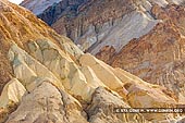 landscapes stock photography | Colorful Artist's Palette, Death Valley, California, USA, Image ID US-DEATH-VALLEY-0010. Multicolored minerals at the Artist's Palette in the Death Valley National Park, California, USA. The colors occur because of the various minerals mixed in the mounds (iron salts for the yellow and reddish tints; mica for green and manganese for purple). The intensity of the colors depends on the time of day and the amount of sunlight. The colors are intensified by the sun near sunset; but are interesting to see at any time of the day.