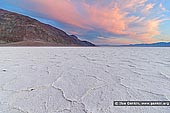 landscapes stock photography | Badwater Sunset, Death Valley, California, USA, Image ID US-DEATH-VALLEY-0007. Sunset over Badwater Salt Flat at Badwater Basin in Death Valley National Park, California, USA which is the lowest point in North America, with an elevation of 282 ft (86 m) below sea level. Repeated freeze-thaw and evaporation cycles gradually push the thin salt crust into hexagonal honeycomb shapes.