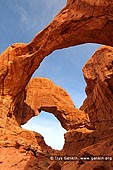 landscapes stock photography | Double Arch, Arches National Park, Utah, USA, Image ID US-UTAH-ARCHES-NATIONAL-PARK-0005. Standing beneath the massive twin span of Double Arch in Arches National Park, Utah, USA is an awe-inspiring moment.
