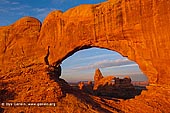 landscapes stock photography | Windows and Turret Arch at Dawn, Arches National Park, Utah, USA, Image ID US-UTAH-ARCHES-NATIONAL-PARK-0007. Turret Arch is beautifully framed by another nearby North Window Arch in Arches National Park in Utah, USA as it was seen early in the morning.