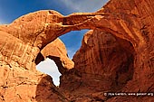 landscapes stock photography | Double Arch in the Morning, Arches National Park, Utah, USA, Image ID US-UTAH-ARCHES-NATIONAL-PARK-0006. Double Arch is arguably the most magnificent sandstone formation in Arches National Park in Utah, USA. Enormous arches like Double Arch in the Windows Section have been sculpted over thousands of years by wind, rain, and other forces of erosion and will eventually collapse as new arches are born.