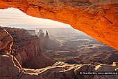 landscapes stock photography | Mesa Arch at Sunrise, Island in the Sky, Canyonlands National Park, Utah, USA, Image ID CANYONLANDS-NATIONAL-PARK-UTAH-USA-0001. Mesa Arch glows during sunrise, Island in the Sky District of the Canyonlands National Park above Colorado River near Moab in Utah, USA.