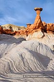 landscapes stock photography | Toadstool Hoodoos, Paria Rimrocks, Grand Staircase-Escalante National Monument, Utah, USA, Image ID US-UTAH-PARIA-RIMROCKS-0001. The Paria Rimrocks area of Grand Staircase-Escalante National Monument in Utah, USA is a unique landscape of white and orange banded Entrada Sandstone that erodes in some areas in the same manner as Bryce Canyon - almost as if it melts away - and in others it sculpts like it does in Arches National Park. One of the most iconic features of the Paria Rimrocks are the Toadstool Hoodoos, Entrada Sandstone hoodoos often capped by slabs of the Dakota Formation. As the Entrada Sandstobe erodes from below the Dakota Formation, small pieces of Dakota slide down and lodge atop areas of Entrada that withstand the erosive forces and form the hoodoos.