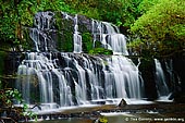 landscapes stock photography | Purakaunui Falls, The Catlins, South Island, New Zealand, Image ID NZ-PURAKAUNUI-FALLS-0003. The Purakaunui Falls is a cascading multi-tiered waterfall on the Purakaunui River, located in the Catlins region in Otago in the southern South Island of New Zealand. It is an iconic image for southeastern New Zealand, and were featured on a New Zealand postage stamp in 1976. This 15m waterfall tumbles in three tiers, giving it a certain grace and character that more than makes up for its lack of height.